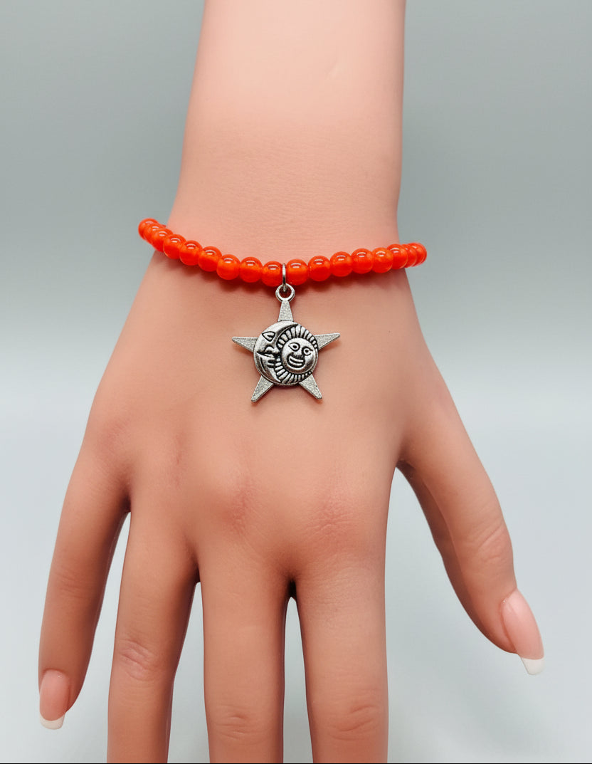 Bracelet - Stretch - Smooth Orange Pearl Like Beads with Silver Tone Star, Moon, Sun Charm