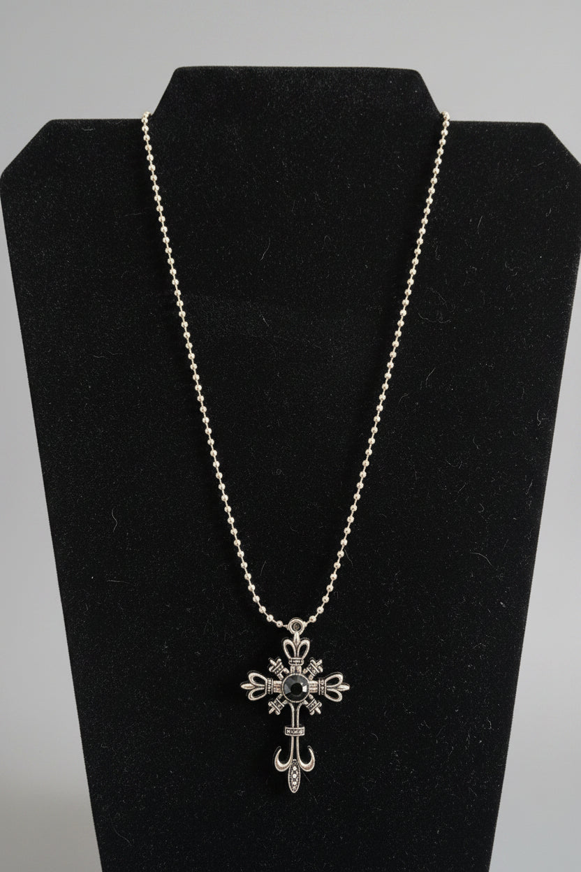 Necklace - Silver-Toned Fleur De Lis Cross featuring a Striking Black Gem