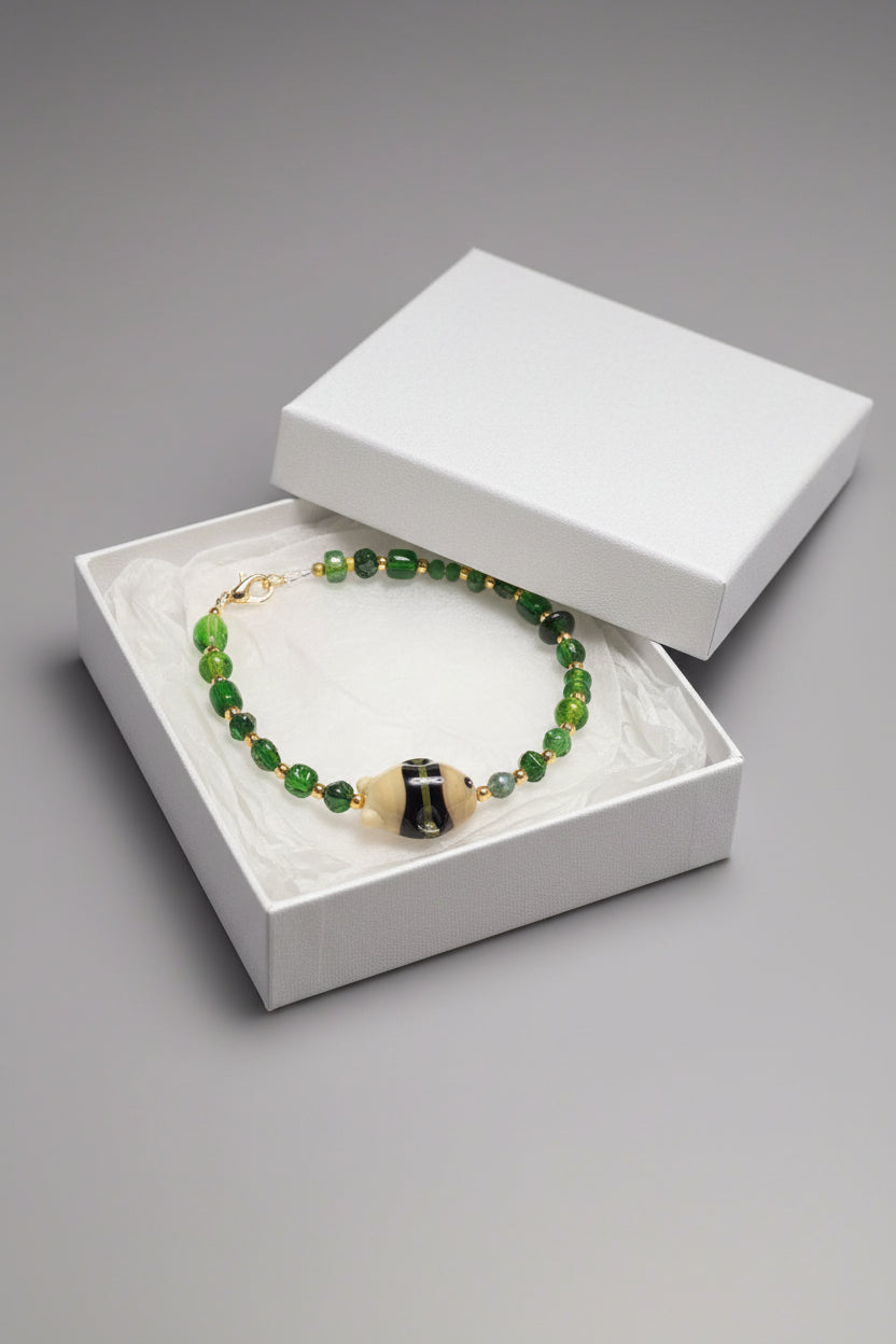 Bracelet - a Mix of Green Glass Beads - with a Ceramic Fish Focal Bead - 7.5"