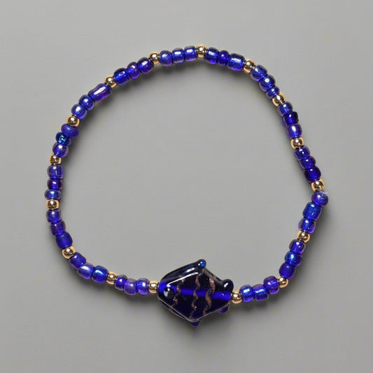 Bracelet - Stretch Blue Seed Beaded - with Gold Spacer Beads - 7"