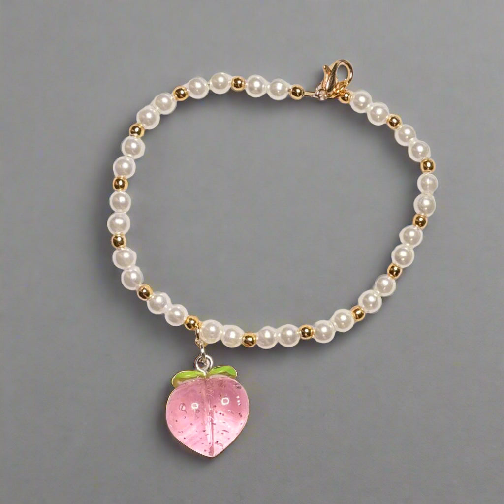 Handmade - 8" Pearl Like Beaded Bracelet with Peach Charm
