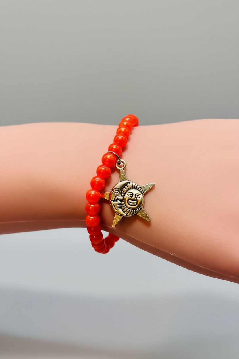 Bracelet - Stretch - Smooth Orange Pearl Like Beads with Silver Tone Star, Moon, Sun Charm