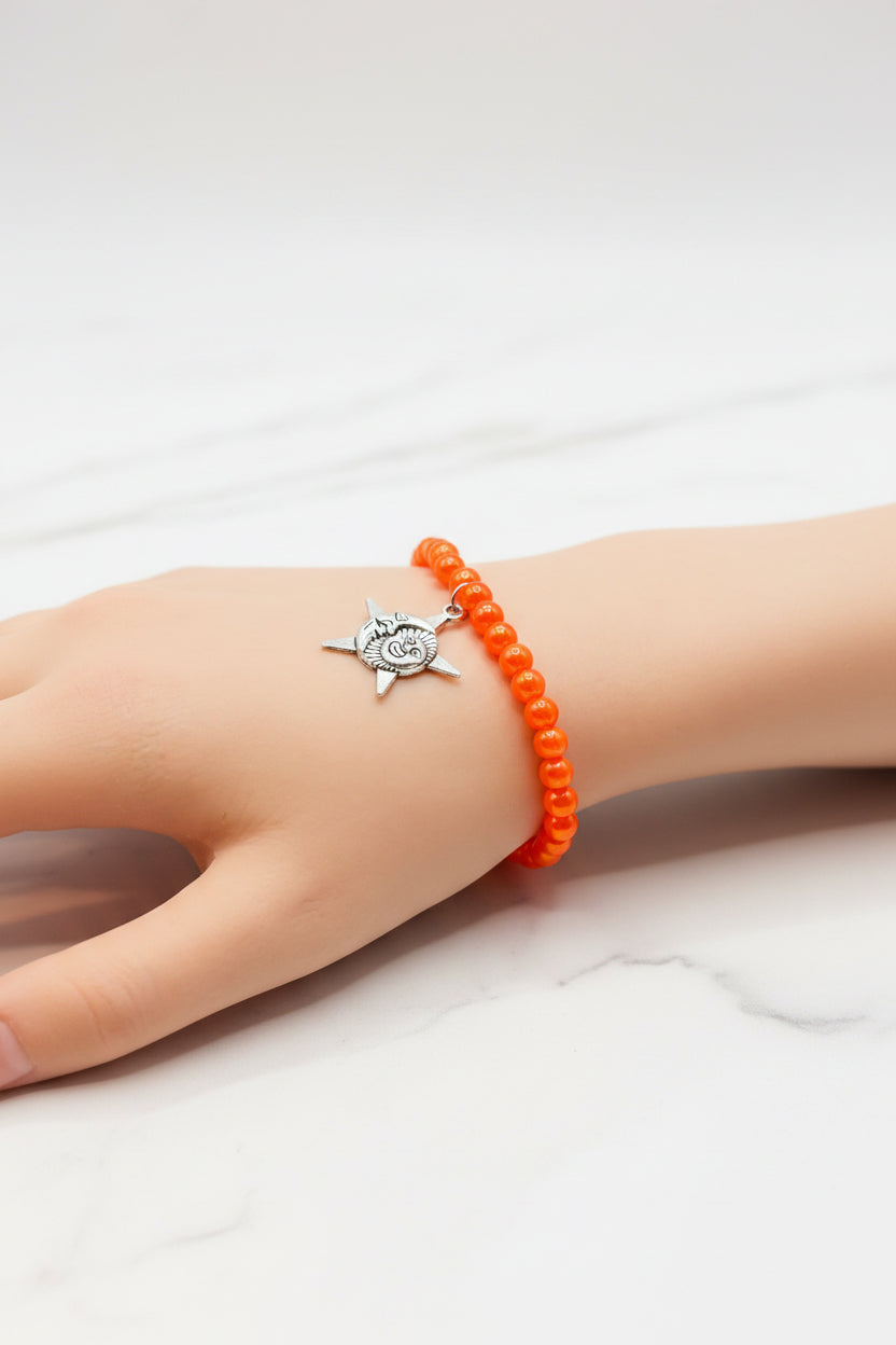 Bracelet - Stretch - Smooth Orange Pearl Like Beads with Silver Tone Star, Moon, Sun Charm