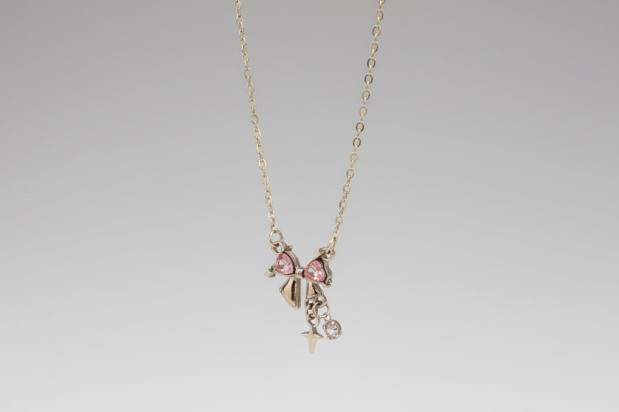Silver-Tone Bow Necklace with Pink Heart- Shaped Rhinestones