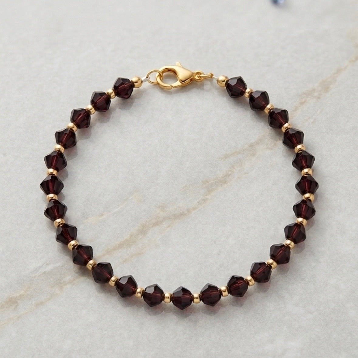 Bracelet - Handmade - Deep Purple Faceted Beads with Gold Spacer Beads