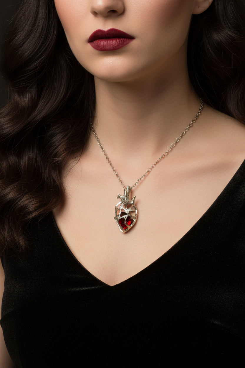 Necklace - Anatomical Silver Tone Heart Pendant with 3D Red Stone Inside Cage