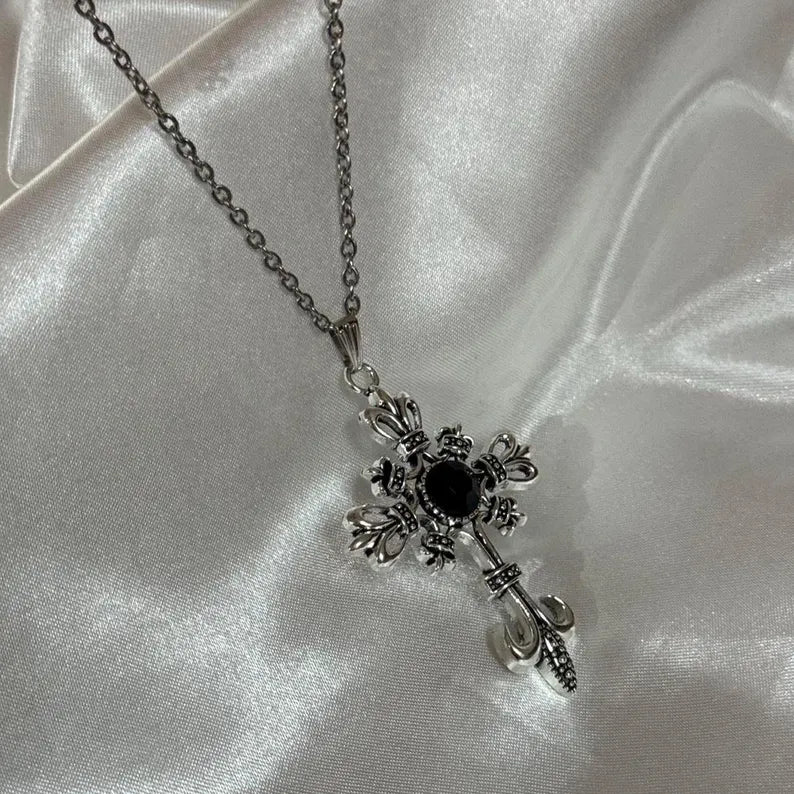 Necklace - Silver-Toned Fleur De Lis Cross featuring a Striking Black Gem